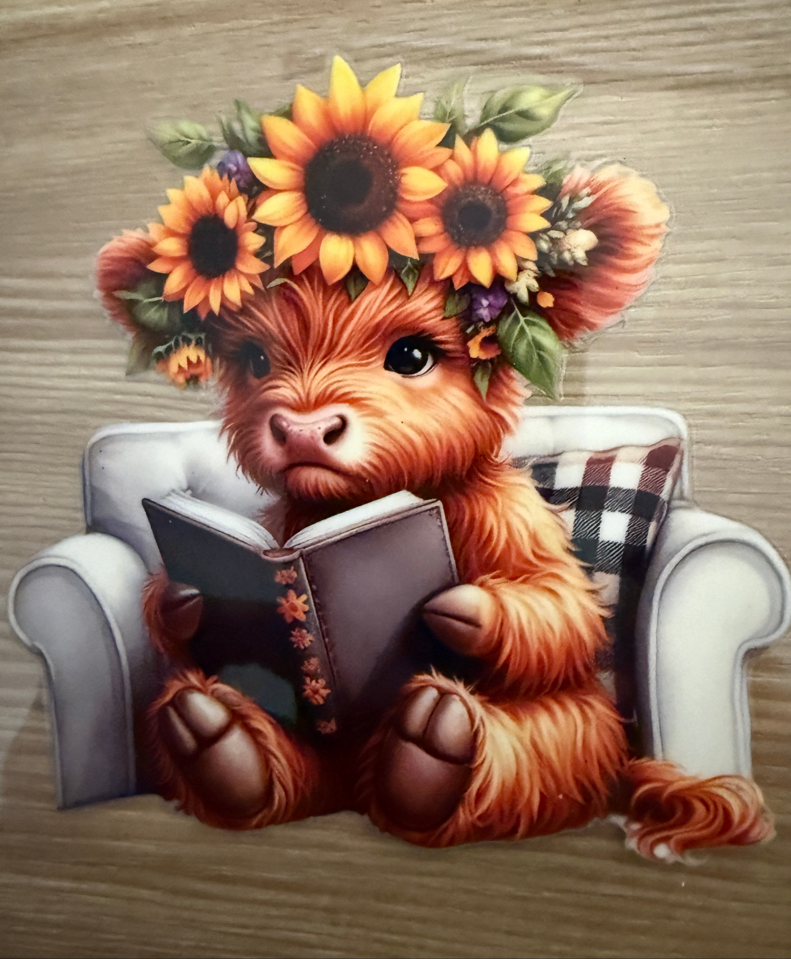 Decal  - Cow reading a book while sitting in a chair