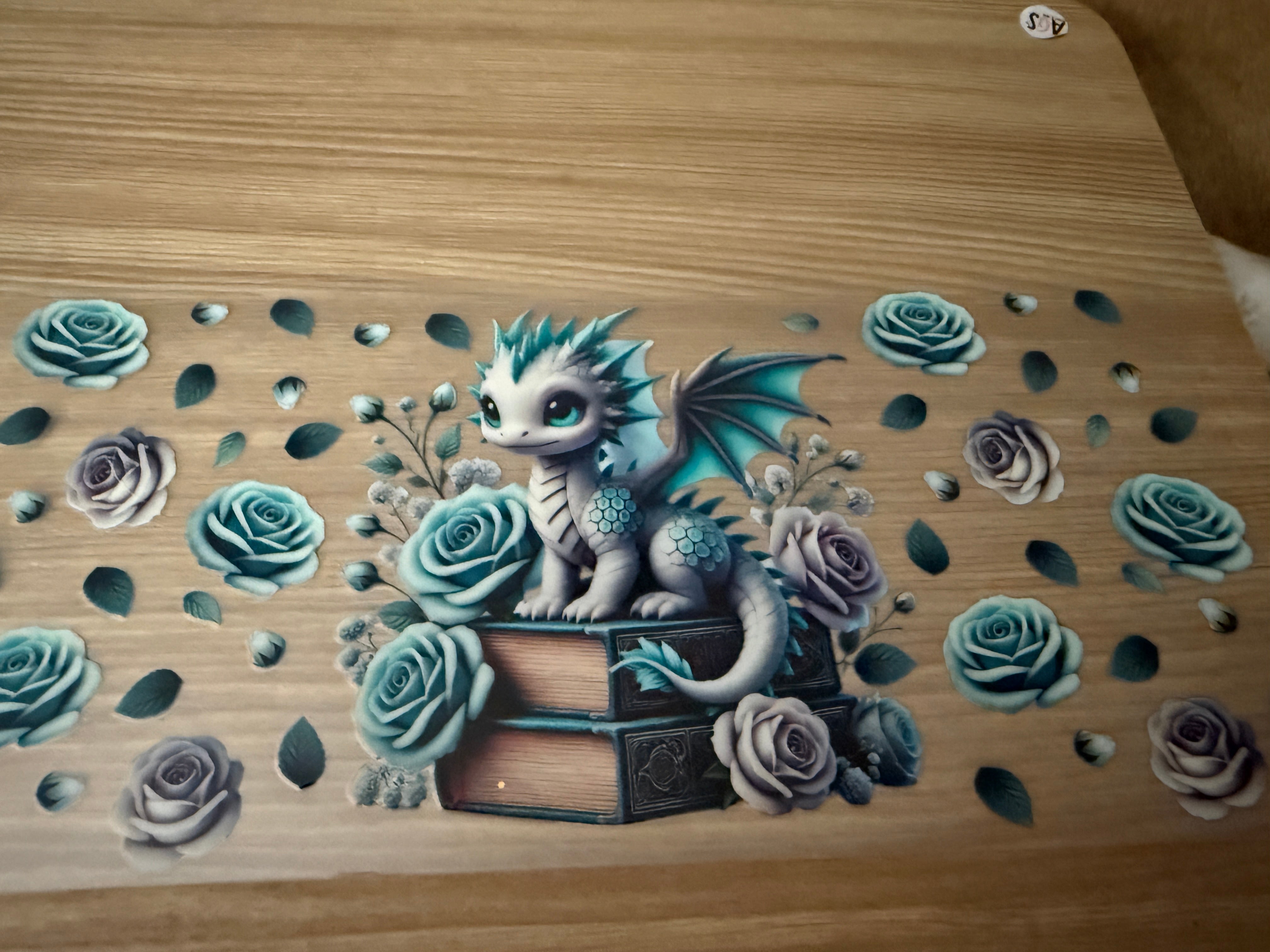 Reptile- Teal Dragon sitting on books